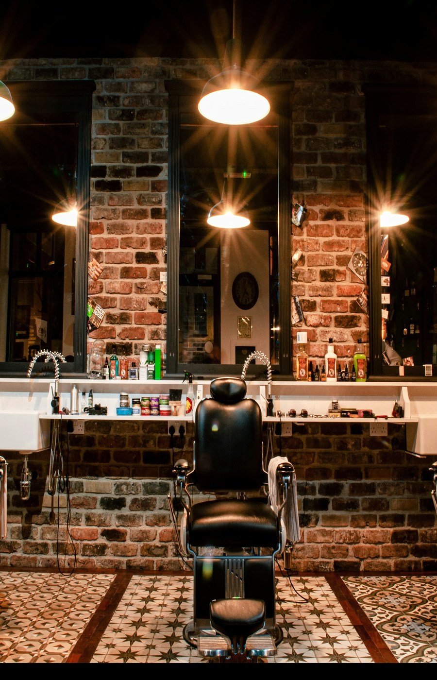The inside of the shop shot against the light, the chairs and mirrors in silhouette